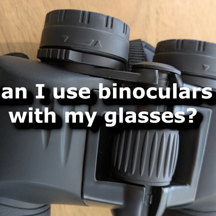 Can I wear my glasses when using binoculars?