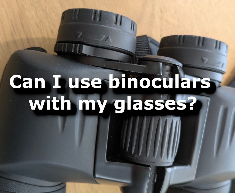 Can I wear my glasses when using binoculars?