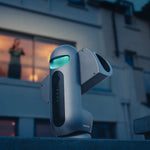 DRACO outside a building at dusk