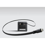 DJI Power 1000 Mini with retractable cable on grey background