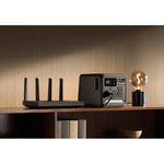 DJI Power 1000 Mini on wooden shelf with router