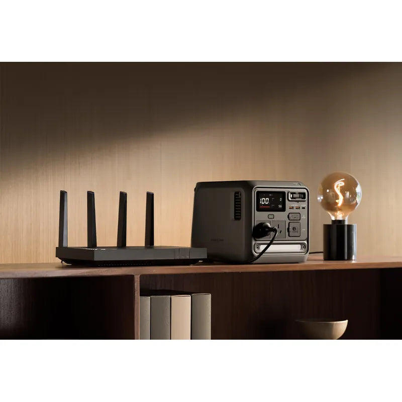 DJI Power 1000 Mini on wooden shelf with router