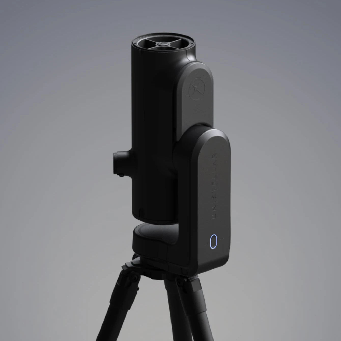 Unistellar Odyssey Pro smart telescope with Nikon eyepiece on its tripod, front view